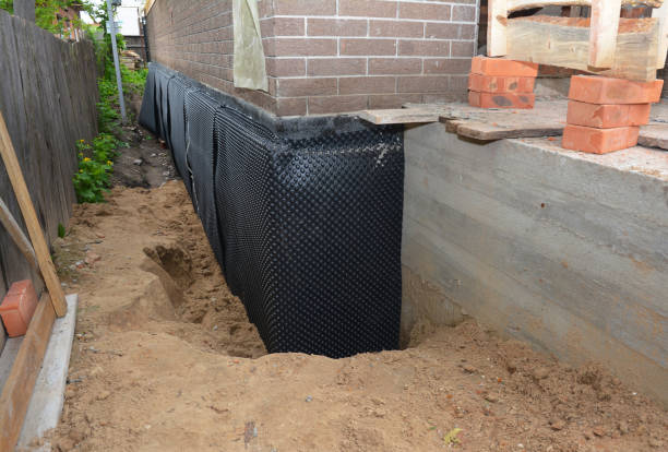 Happy homeowners after waterproofing job in Cowlesville